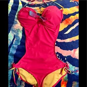 JOE BOXER Pink w/side cut out one piece. Stone accents at heart shaped bust.